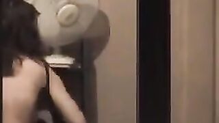 He admires to himself in the mirror, completely naked