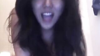 An Asian girl caresses herself, showcasing her sensual solo masturbation skills