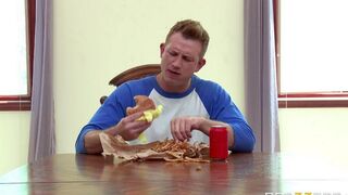 A wife, not bored, fucks herself with a cucumber while her husband watches