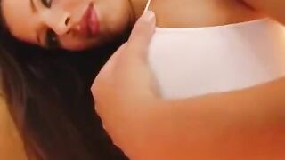 The girl plays with a dildo in her wet vagina