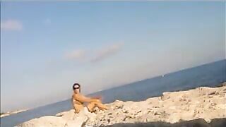Nude sunbathing on the beach is a very pleasant pleasure