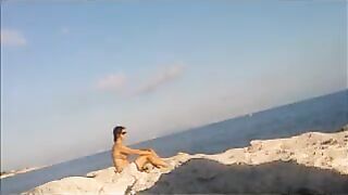 Nude sunbathing on the beach is a very pleasant pleasure