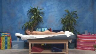 An 18-year-old girl is massaging her client with oil