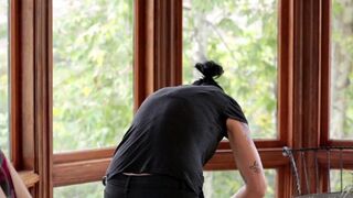 Vietnamese girl fucked in the kitchen by a strap-on