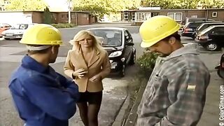 A cute blonde fucks with her partner in black pantyhose on a porn set