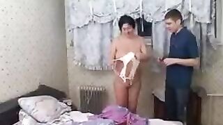 The old woman was fucked by her young son, showcasing intense incest