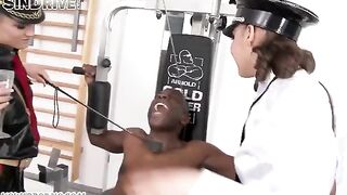 Two girls are having fun with a negro guy wearing latex clothes