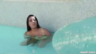 A girl is having fun with the guy in the pool