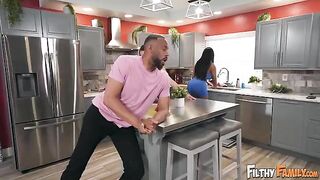 He is so big! A stunning woman on the kitchen