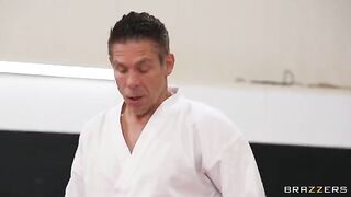 A girl is having fun with her coach in an uncomfortable pose