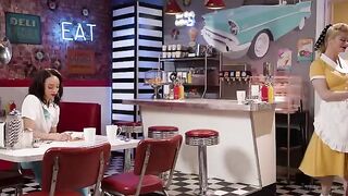 A hot chick is working as an unusual waitress on high heels