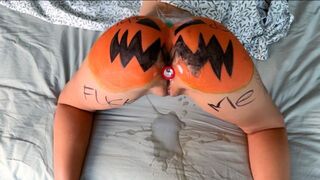 The guy smashed a pumpkin and caressed the girl’s body with it