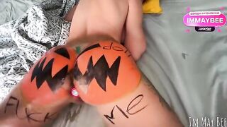 The guy smashed a pumpkin and caressed the girl’s body with it