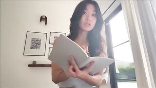 A nerdy girl shares a bed with her Asian step-sister during a study break