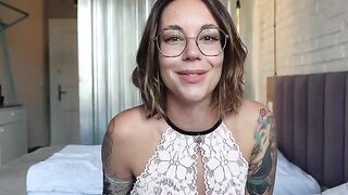 A completely naked girl spreads her legs and plays with toys