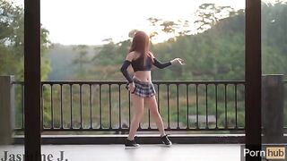 A girl with a wet pussy squirts while masturbating on the balcony, inspired by Jasmine J’s passionate performances